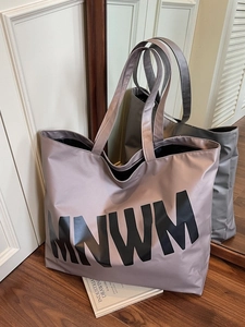Minimalist mauve tote bag with black MNWM letters in a spacious shoulder bag design