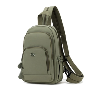 Detail view of army green nylon crossbody bag showing multiple zipper compartments