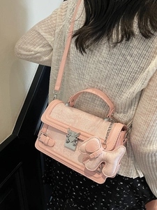 Pink floral jacquard handbag with dog charm and adjustable leather shoulder strap