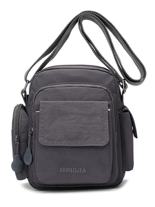 Dark grey nylon crossbody bag with multi-layer zippers and adjustable wide strap