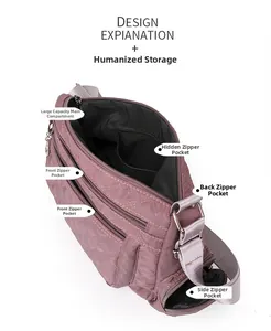 Macro view of mauve nylon crossbody bag featuring diamond quilting and multiple zippered pockets
