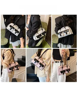 Detailed views of dual-pocket shoulder bag in cream and pink on a lifestyle model