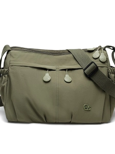 Olive green nylon crossbody tote bag with multi-pocket design and adjustable shoulder strap
