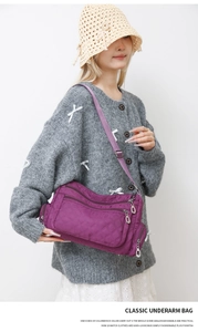Classic purple nylon crossbody bag with diamond quilting and multiple zip pockets