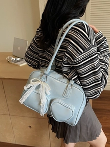 Light blue glossy patent leather shoulder bag with heart pockets and pearl bow charm