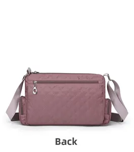 Rear view of purple quilted nylon crossbody bag showing back zipper pocket and side pockets
