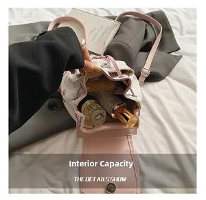 Detail showing the spacious interior capacity of floral bucket bag for daily essentials