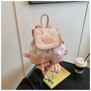 Detailed view of mini drawstring backpack with cute floral bear prints and pink leather trim