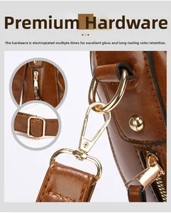 Dettaglio degli accessori metallici dorati su una borsa a secchiello in pelle marrone vintage