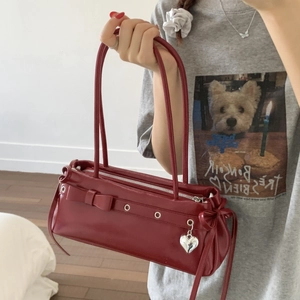 Vintage burgundy baguette bag with chic leather bow and silver heart charm details