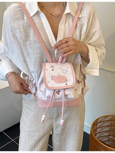 Cute pink and white cartoon print mini backpack with adjustable straps and bucket design
