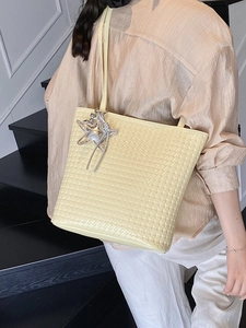 Chic yellow woven bucket bag with star tassel charm for elegant women's daily commute