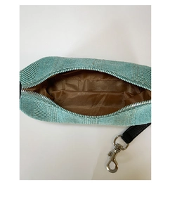 Detailed interior of woven canvas dumpling bag showing brown lining and silver zipper