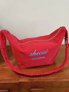 Large capacity red crescent hobo bag with pleated shoulder strap and brand print