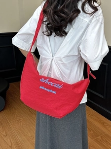Large red canvas crescent crossbody bag with embroidery and adjustable strap