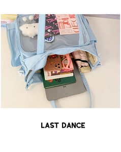 Detailed view of the large capacity light blue backpack showing organized interior compartments