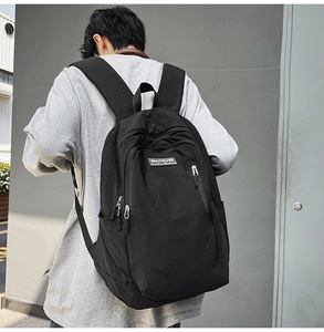 Rear view of a black fashion backpack for women showing ergonomic wide shoulder straps