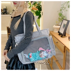 Detailed view of gray nylon ita bag with large transparent PVC window for badges