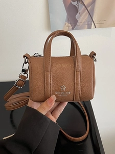 Brown mini boston bag in lychee pattern leather with silver hardware and shoulder strap
