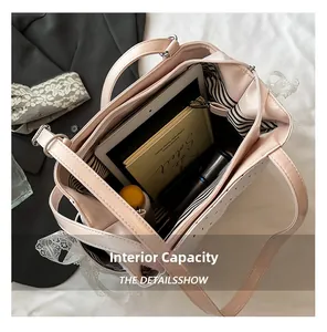 Intérieur spacieux du sac cabas en cuir rose avec compartiments pour tablette et objets