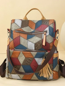 Multicolor patchwork faux leather backpack with crocodile texture and tassel detail