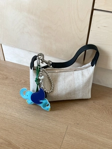Summer woven top handle bag with herringbone pattern and cute elephant charm