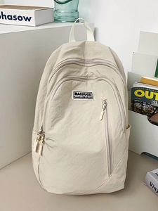 Minimalist beige nylon backpack with multi-pocket design for fashion commute and travel
