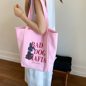 Pink canvas tote bag featuring bad dog illustration and pink plaid inner lining
