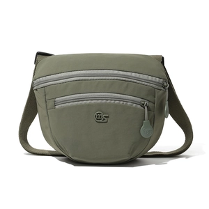 Detail of army green nylon saddle bag with double front zippers and adjustable wide strap
