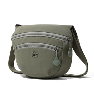 Detail view of olive green waterproof nylon crossbody bag with multi-layer zippers