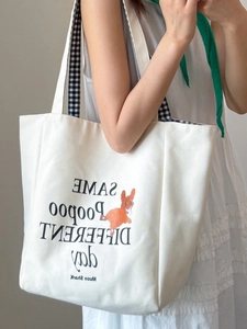 White canvas tote bag with dog print and stylish checkered pattern shoulder straps