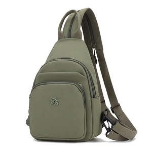 Detail of olive green nylon sports chest bag showing durable fabric and zipper pocket
