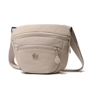Close-up of beige nylon crossbody bag featuring double front zipper pockets and texture