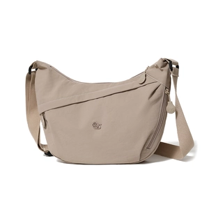 Detail of beige nylon crossbody bag showing adjustable strap and branded zipper pocket