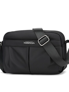 Sleek black multi-layer nylon crossbody bag with adjustable strap and silver logo
