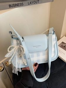 Blue and white checkered shoulder bag with decorative pearl lace bow pendant accessory