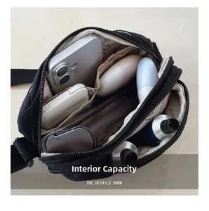 Macro view of the multi-layer interior capacity with organized pockets in a black crossbody bag