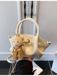 Chic cream white crocodile pattern bucket bag with cute bear charm and long shoulder strap