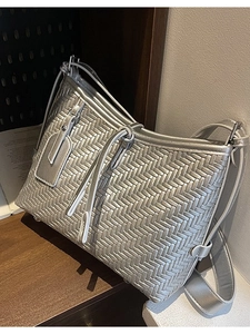 Silver woven faux leather tote bag with metallic finish and long shoulder strap