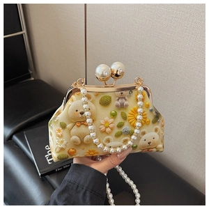 Detail of shell bag with 3D bear floral prints and elegant pearl chain handle