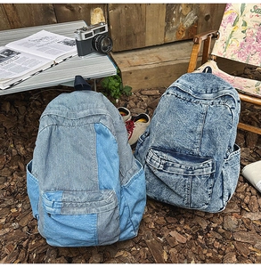 Outdoor shot of vintage denim backpacks with corduroy patchwork and acid wash finish