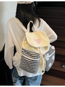 Minimalist Korean canvas backpack with heart motif and plaid pocket for travel