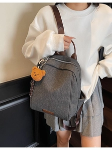 Grey contrast school backpack for women with brown straps and cute bear keychain