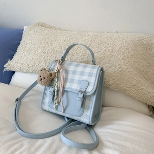 Mini plaid backpack for women with bear pendant and adjustable strap in light blue