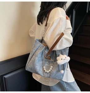 Floral canvas tote bag featuring premium brown leather straps with metal chain and pearl charms