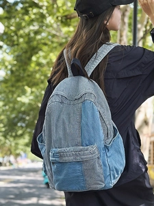 Retro patchwork denim backpack with blue stripes and adjustable straps for casual school use