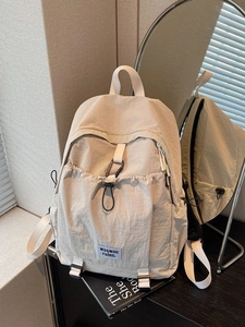 Minimalist beige large capacity commuter backpack for women in waterproof fabric