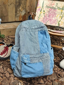 Minimalist denim patchwork backpack with blue and white stripes for outdoor leisure and school