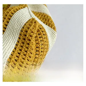 Macro shot of striped yellow and white hand-woven fabric detail for summer beach bag