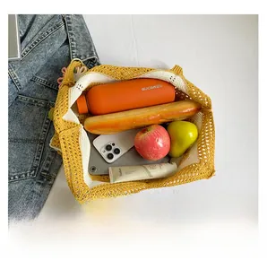 Spacious yellow crochet shoulder bag showing large interior capacity for daily essentials